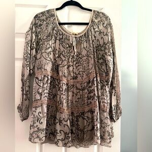 Grey/black top. Never worn . size small . can fit up to a large